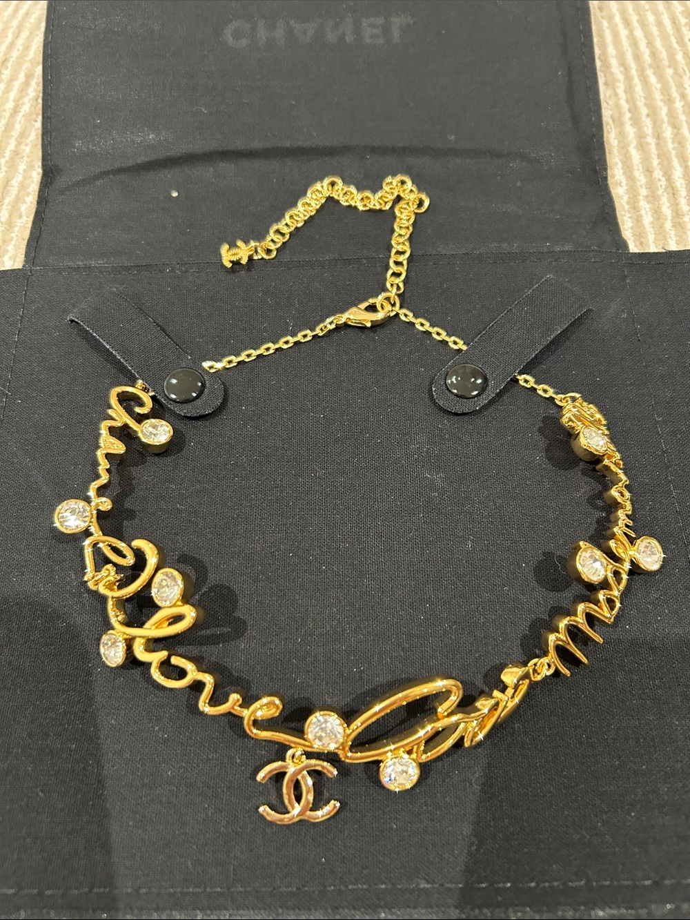 CHANEL Gold Script Logo Necklace with Crystal Accents